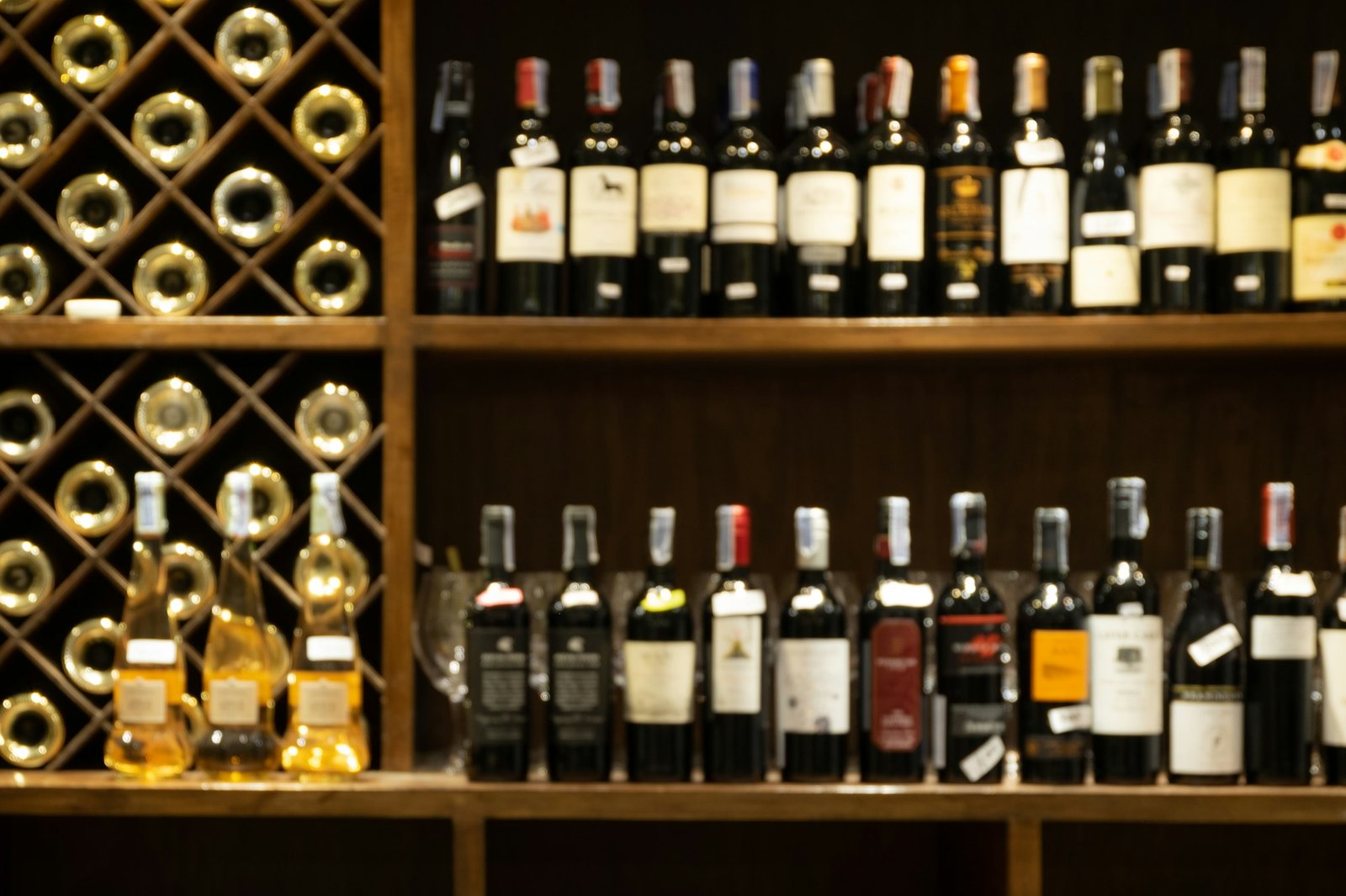 Bar counter with defocused background and bottles of restaurant, bar or cafeteria.